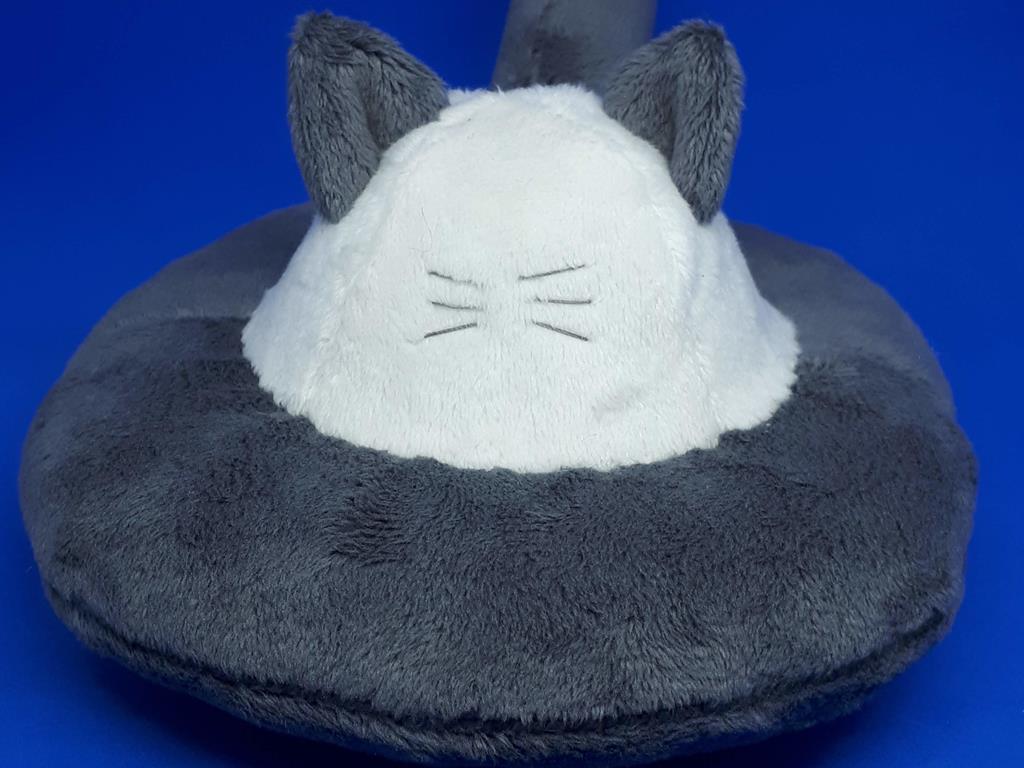 A flying saucer with cat ears, a tail, and whiskers. It is grey and white.